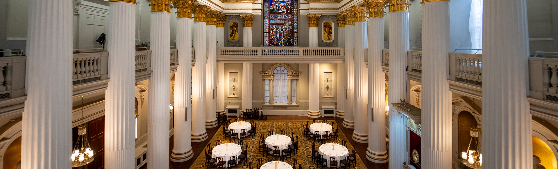 An aerial shot of a various dinner tables within Mansion House