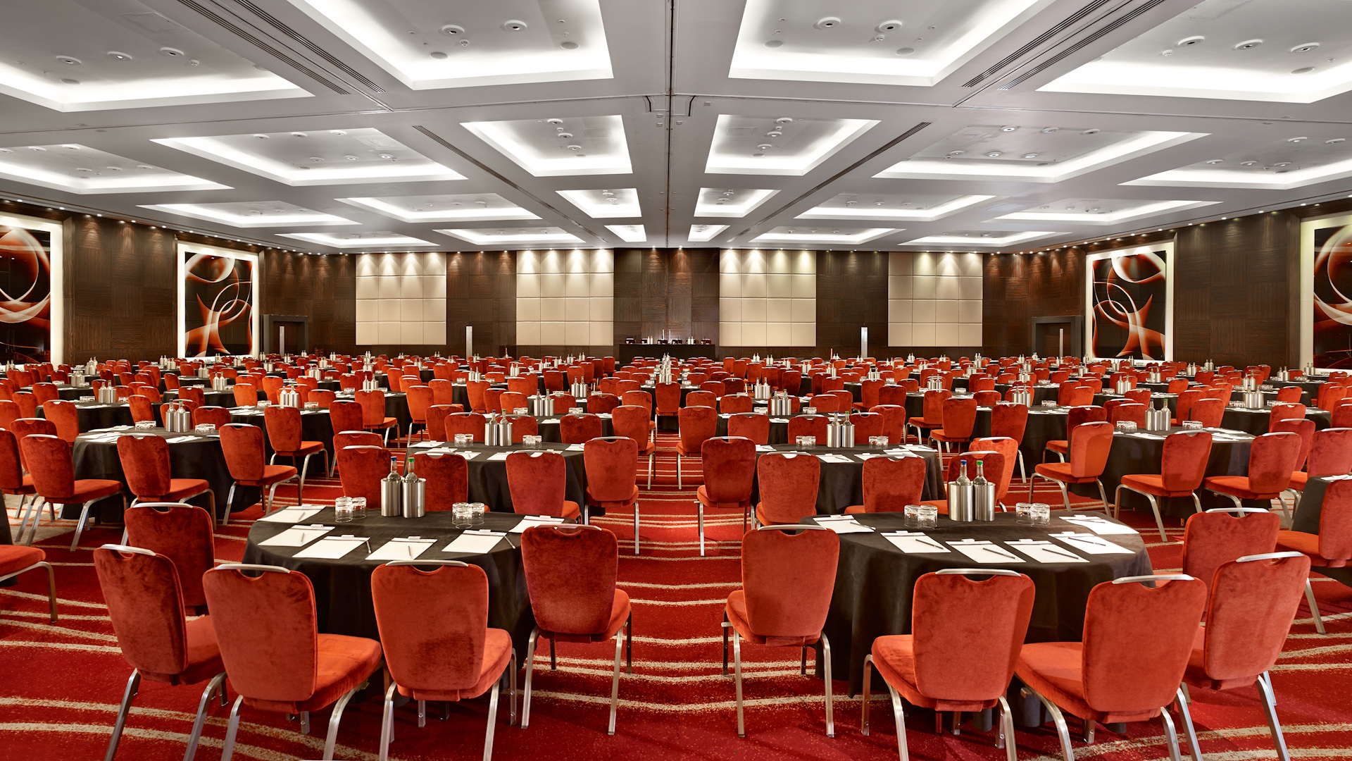 Park Plaza London large meeting room with red chairs and carpets.