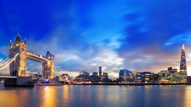 View of Tower Bridge, the Shard and the river Thames at sunset in London.