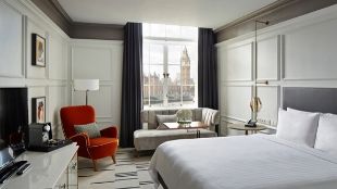 Interior of a room at London Marriott Hotel County Hall. Big Ben is visible through the window.
