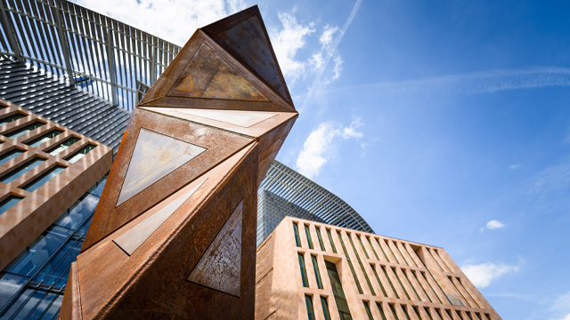 A view of a modern building with geometric features.