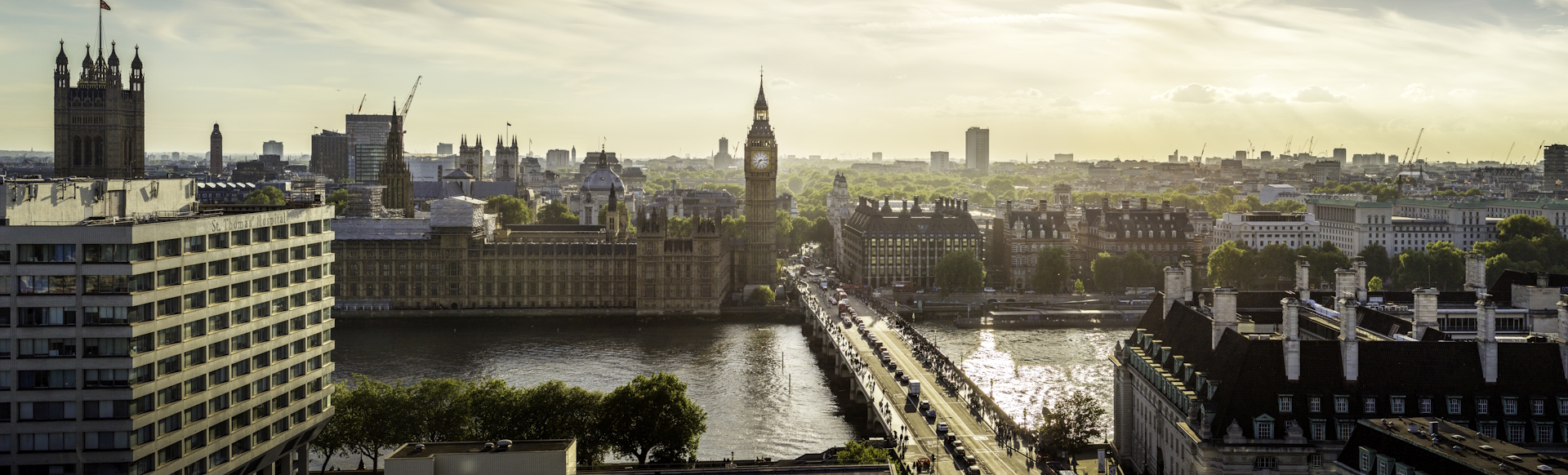 View of Westminster skyline on a sunny day, with the river Thames, Westminster Bridge, Big Ben and the Houses of Parliament.