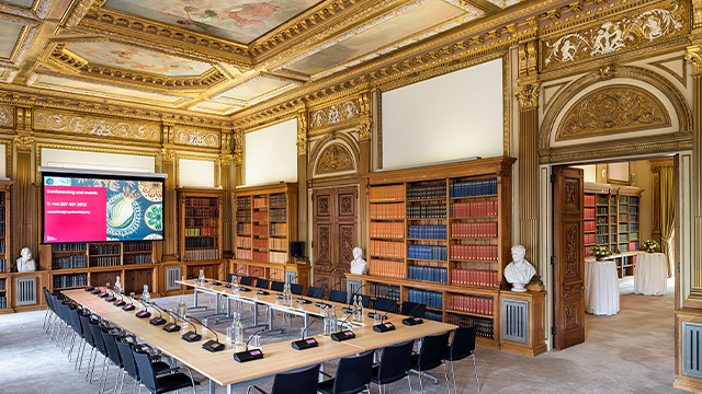 A meet room at the Royal Society with gold, painted ceilings