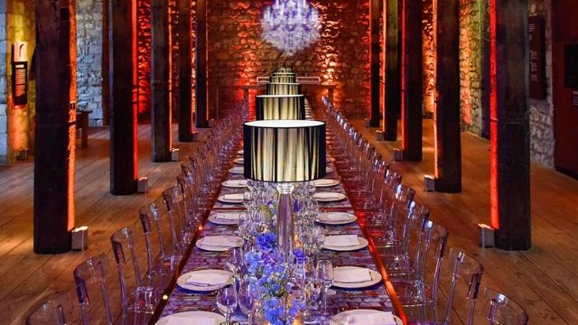 Dining table arrangement with clear chairs in the Tower of London, Historic Royal Palaces.