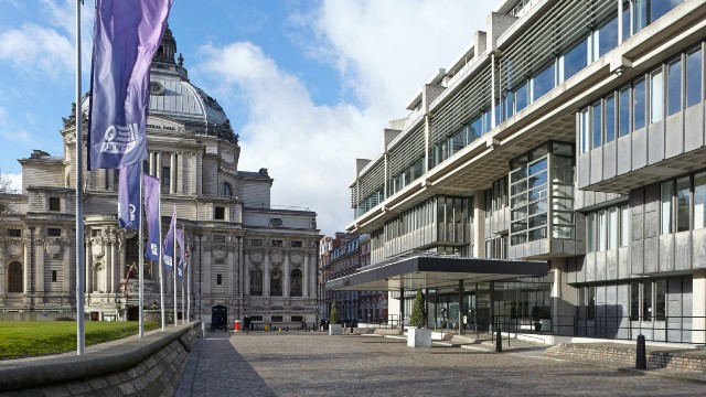Exterior view of the Queen Elizabeth II Centre in London on a sunny day.