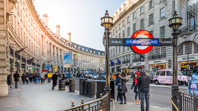 Underground station entry, with the curved Regent Street architecture in the background.