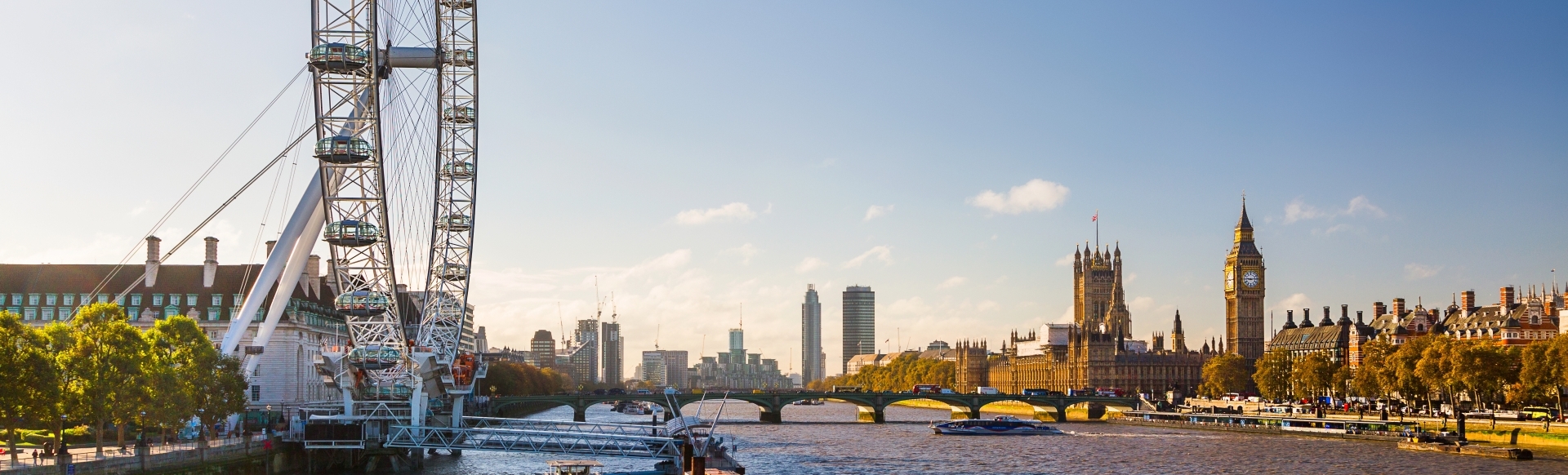 The river Thames on a sunny day, with Westminster in the background.