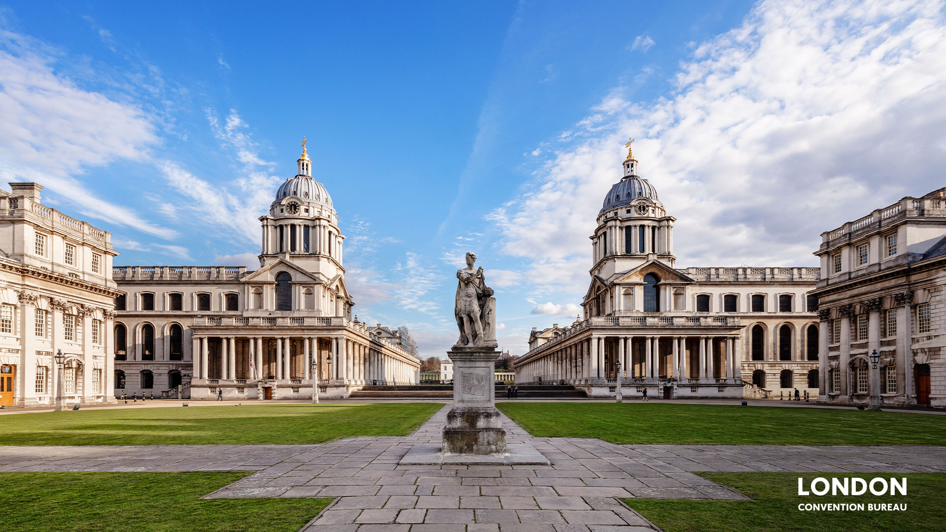 Greenwich Royal Naval College front view with a statue in the centre.