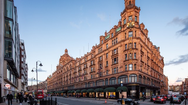 An image of a redbrick historic department store on a busy London street.